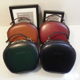 round leather handbag
