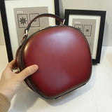red round leather purse