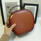 brown round leather purse