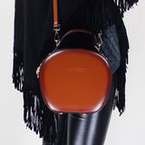 brown leather bag round
