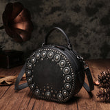 Studded round leather crossbody bag