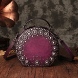 Studded round leather crossbody bag