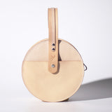 beige circle leather purse