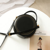 Black round leather crossbody bag
