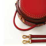 Red round leather handbag