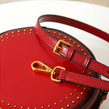 Red round leather handbag