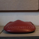 A reddish-brown leather pouch 