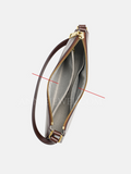 An open leather clutch or wristlet bag with a brown exterior, gold-tone zipper and hardware, and a gray interior lining.