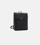 A black leather backpack with a top flap and a small gold button closure