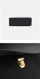 A close-up of a black pebbled leather bag 