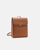 A tan leather backpack with a flap closure and a small gold butto