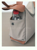 side of Nylon Leather Trim Bag Soft Nylon Hobo Bag Nylon Slouchy Shoulder Bag DR