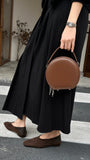 brown leather round bag with zipper
leather circle bag with top handle womens