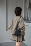 small leather round bag with zipper
leather circle bag with top handle womens