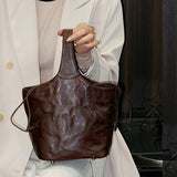 brown leather bucket handbag