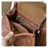 Close-up of a brown leather handbag interior