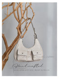 leather underarm bag two pockets
leather shoulder bag with double front pockets