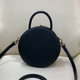 black round purse