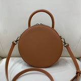 Brown circle leather handbag