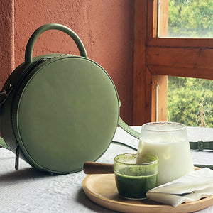 Green leather round bag